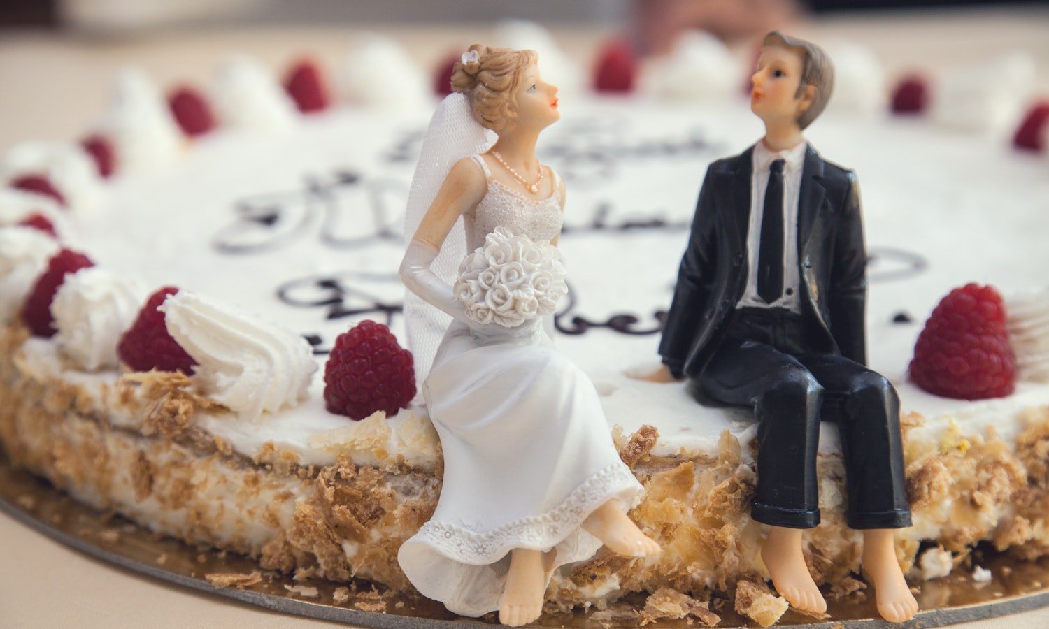 bride and groom on wedding cake