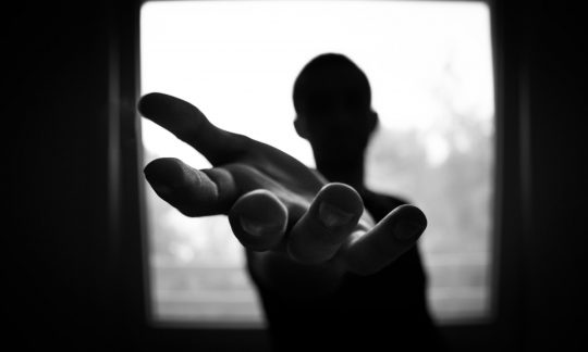 Man's hand in shallow focus