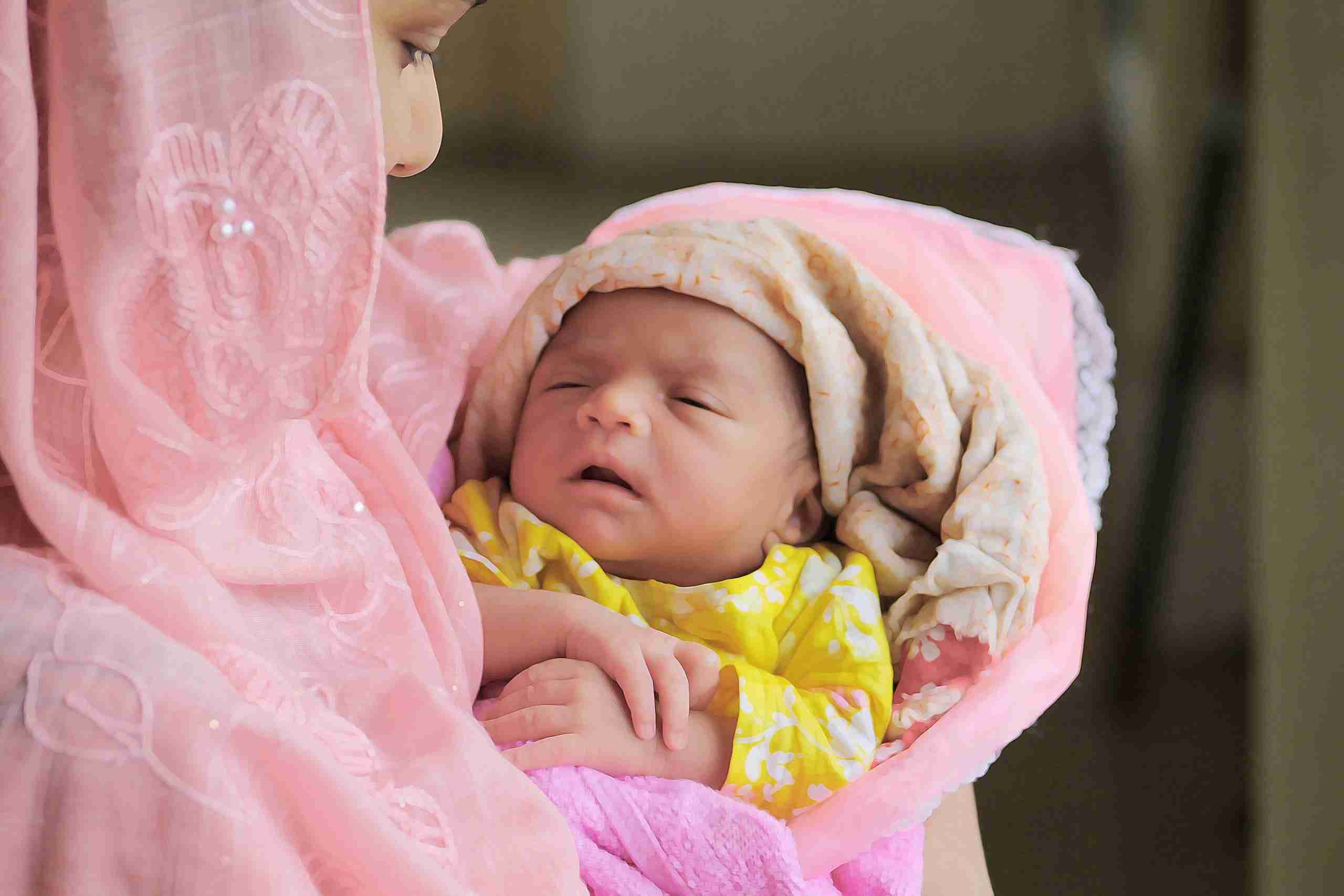 baby-in-pink-and-white-blanket
