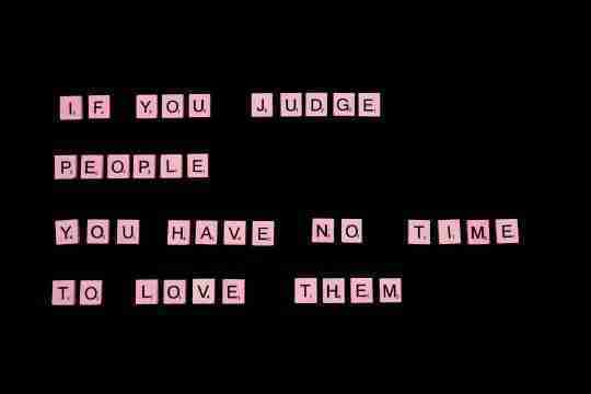 inspirational-quote-spelled-out-with-board-game-letter-tiles-