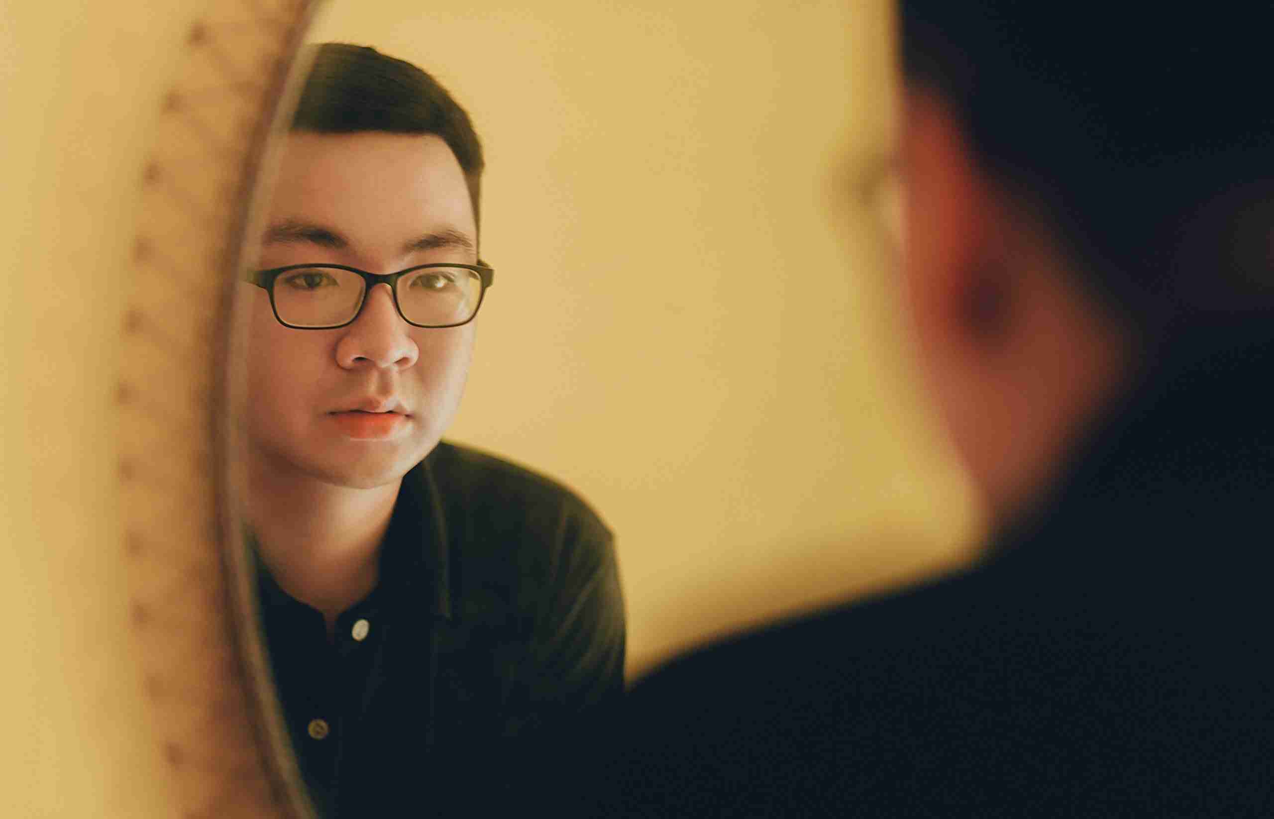 photo-of-man-looking-at-the-mirror