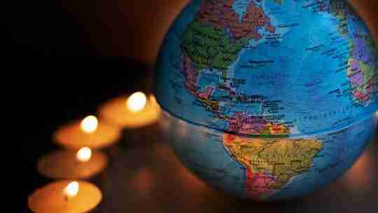 round-globe-surrounded-with-candles