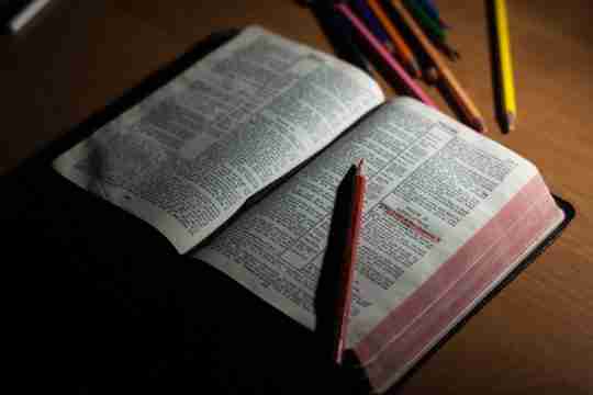 pink-pencil-on-open-bible-page-and-pink